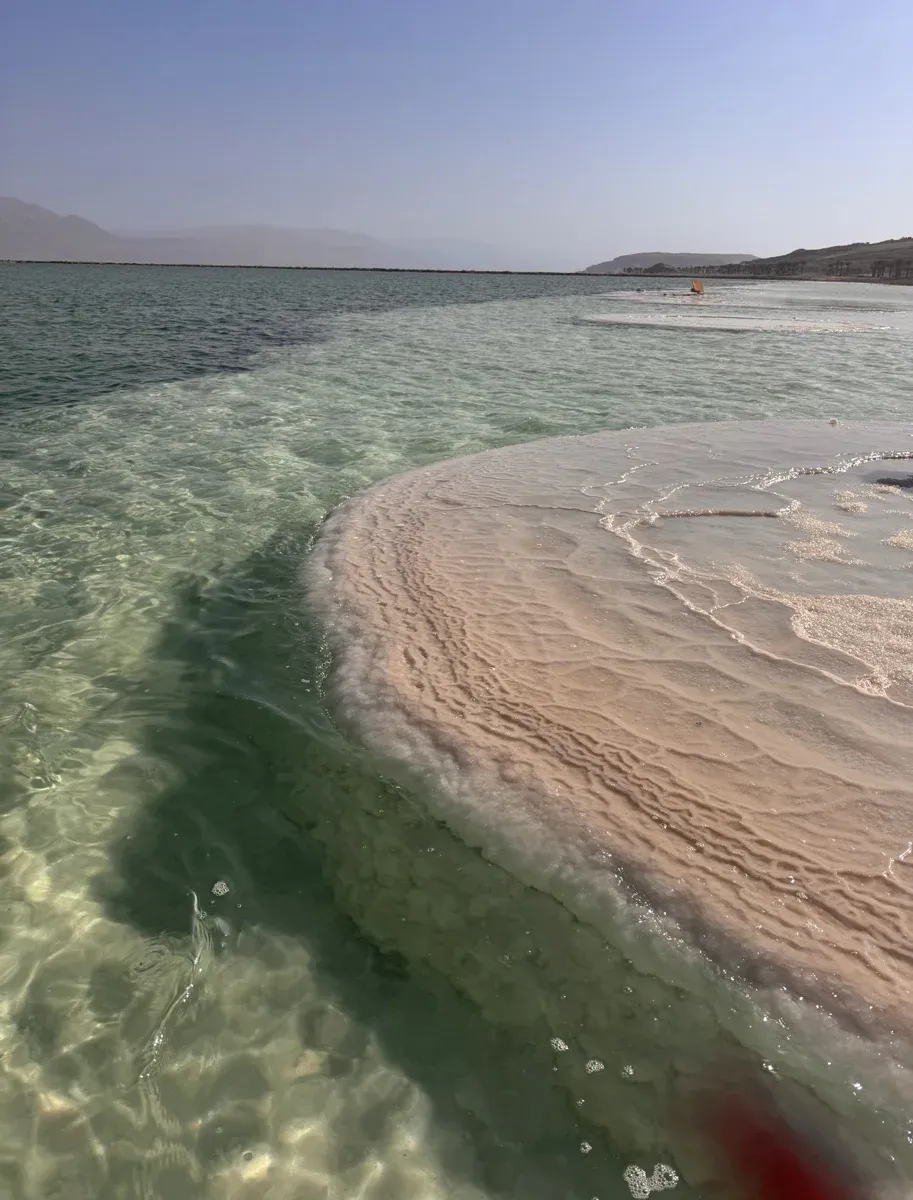 Salt terraces on the shore of the Dead Sea, seen on a Dead Sea resort day
